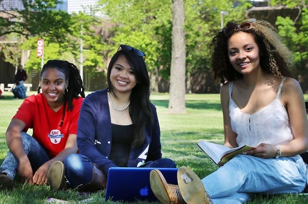 Group of students sitting together on campus